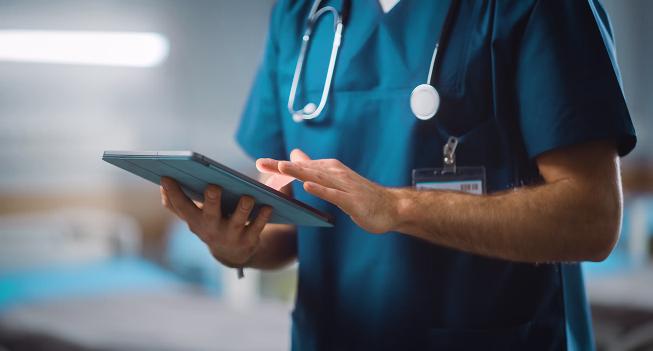 Doctor Uses Digital Tablet Computer Health Care Vitals Monitoring